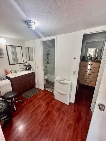 a room with a chair and wooden floor