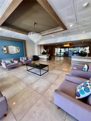 a view of swimming pool with outdoor seating and a projector