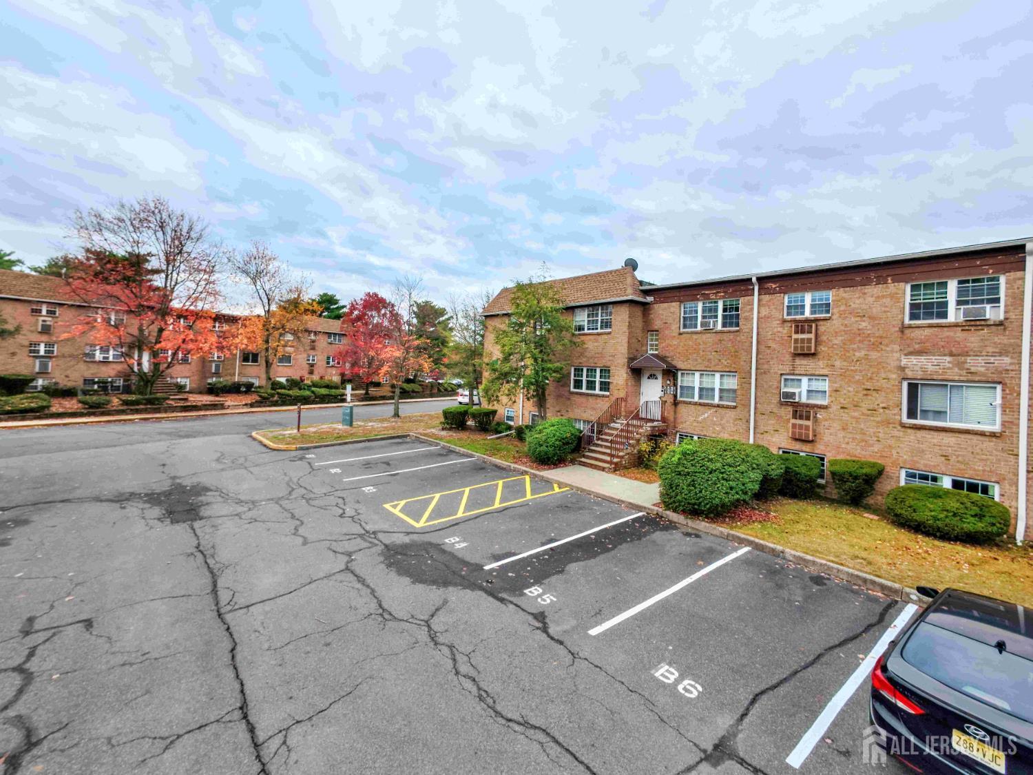 14 College Drive Edison, NJ 08817 - Photo 3 of 22 a view of a street with a building in the background