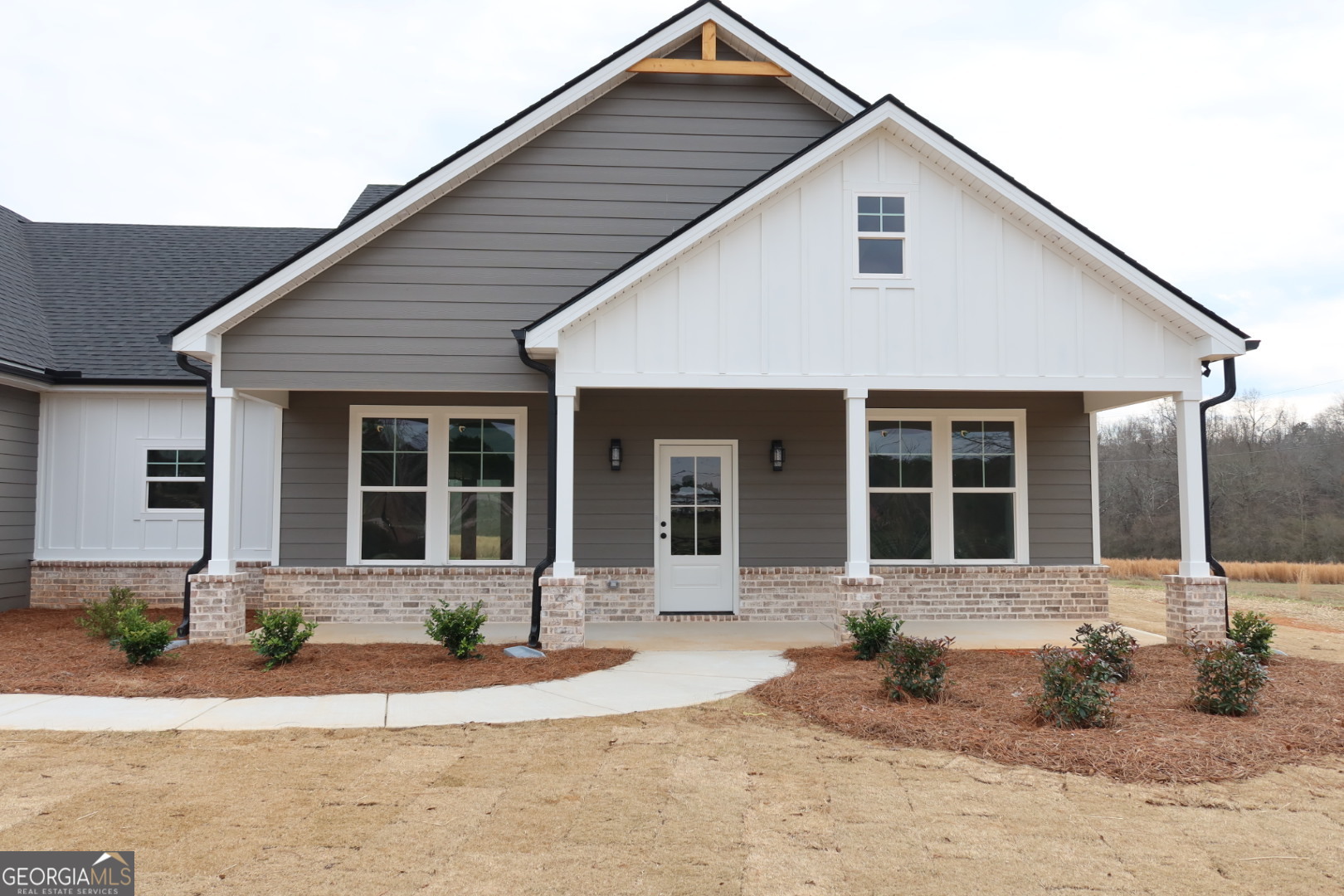 1205 Rocky Creek Road Hampton, GA 30228 - Photo 3 of 9 a front view of a house with a patio