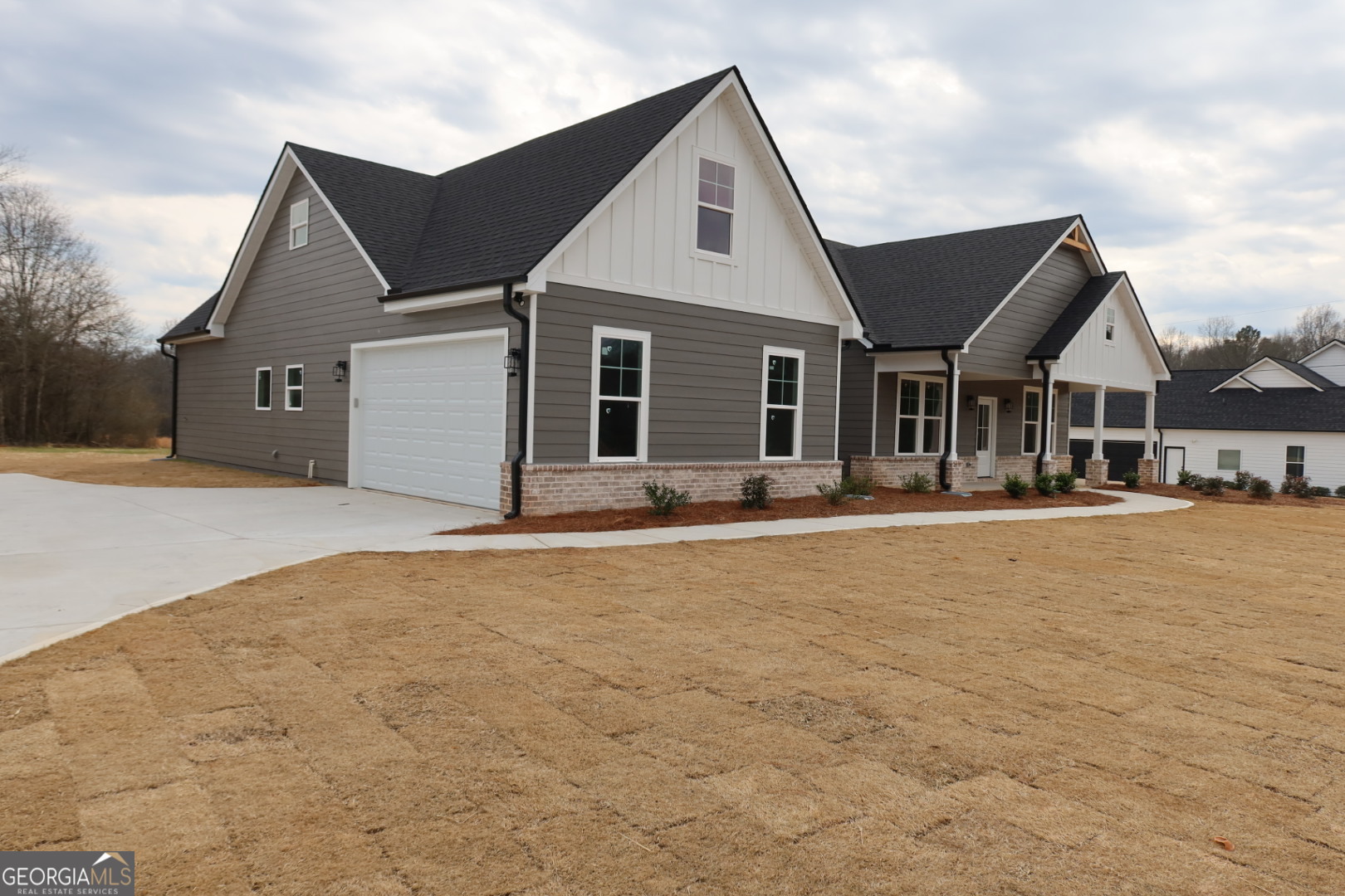 1205 Rocky Creek Road Hampton, GA 30228 - Photo 4 of 9 a front view of house with yard and trees in the background