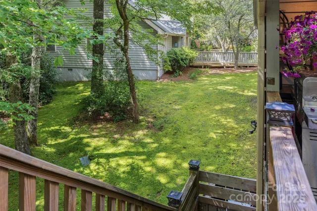 a view of a backyard with sitting area