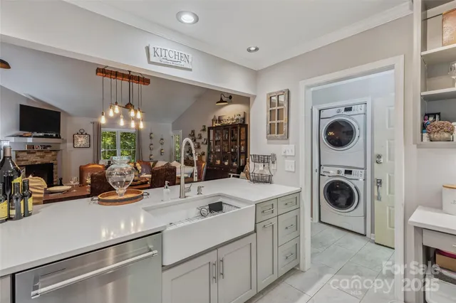 a view of a kitchen sink washer and dryer