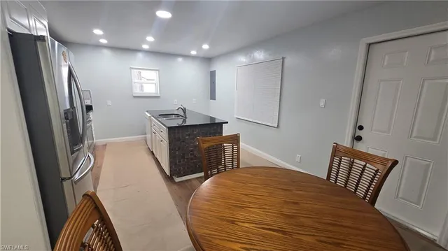a bedroom with furniture and a wooden floor