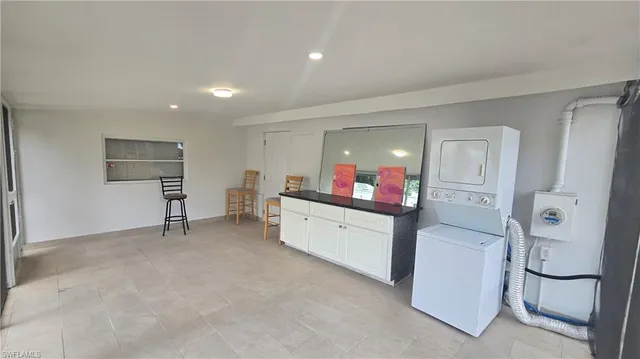 a view of livingroom with furniture and window