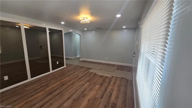 a bathroom with a shower and a glass door