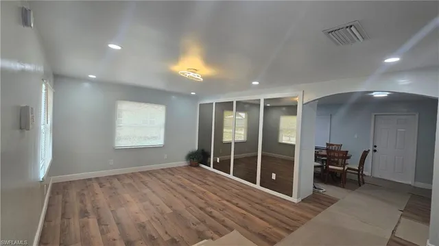 a view of a room with furniture and window