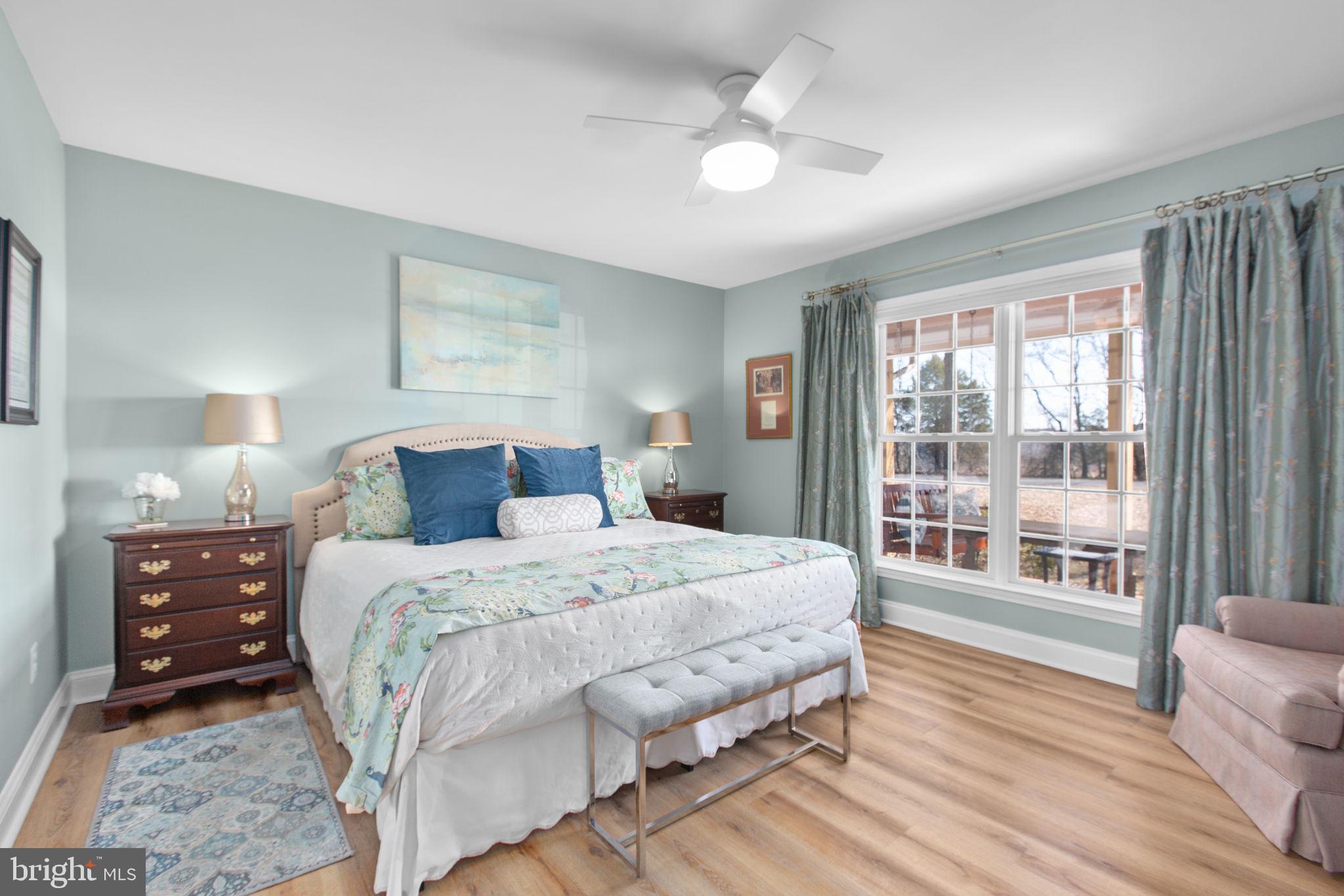 28896 Horseshoe Road Culpeper, VA 22701 - Photo 13 of 36 a bedroom with a large bed and a tv on the dresser