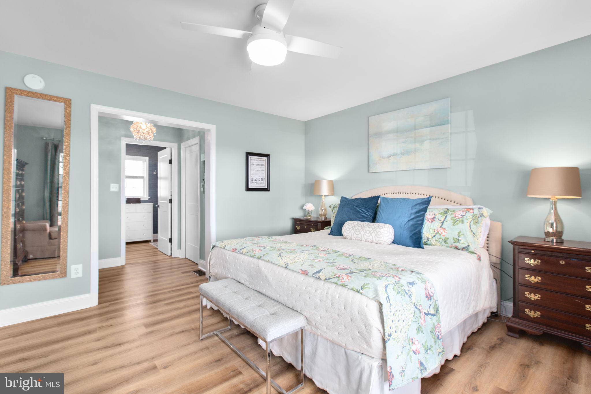 28896 Horseshoe Road Culpeper, VA 22701 - Photo 15 of 36 a spacious bedroom with a bed and a lamp