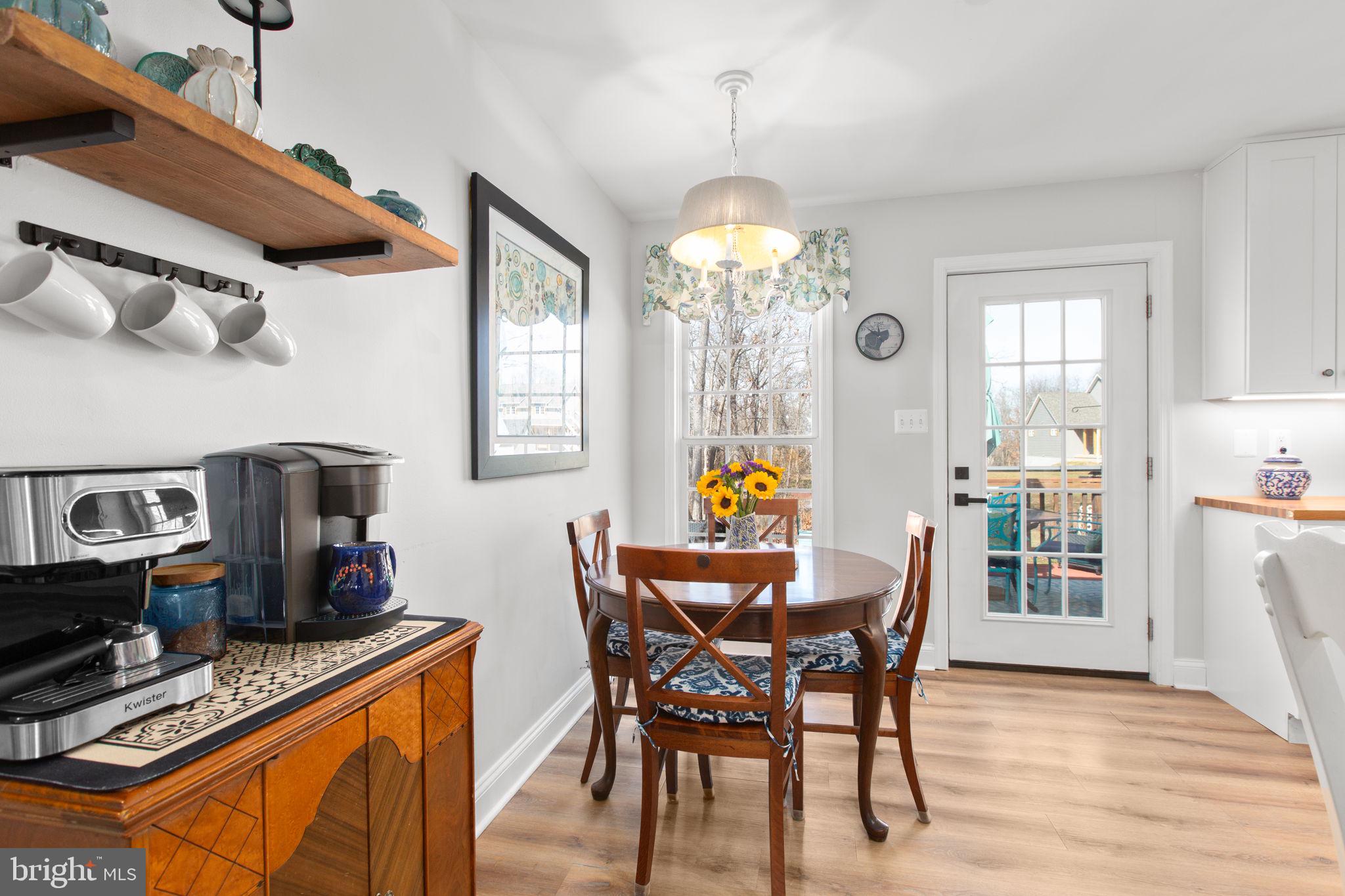 28896 Horseshoe Road Culpeper, VA 22701 - Photo 18 of 36 a view of a dining room with furniture and chandelier