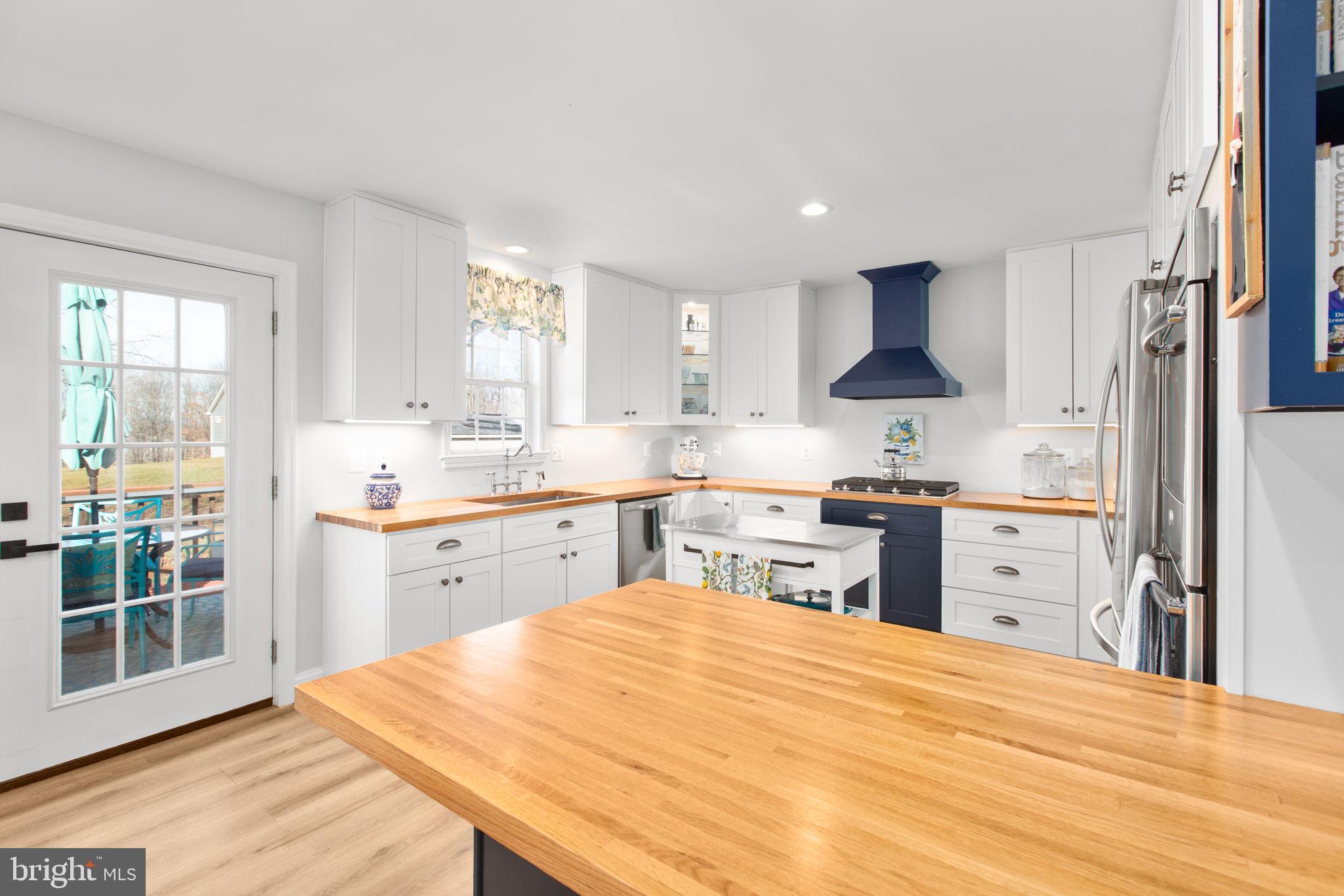 28896 Horseshoe Road Culpeper, VA 22701 - Photo 20 of 36 a kitchen with a refrigerator stove top oven and sink