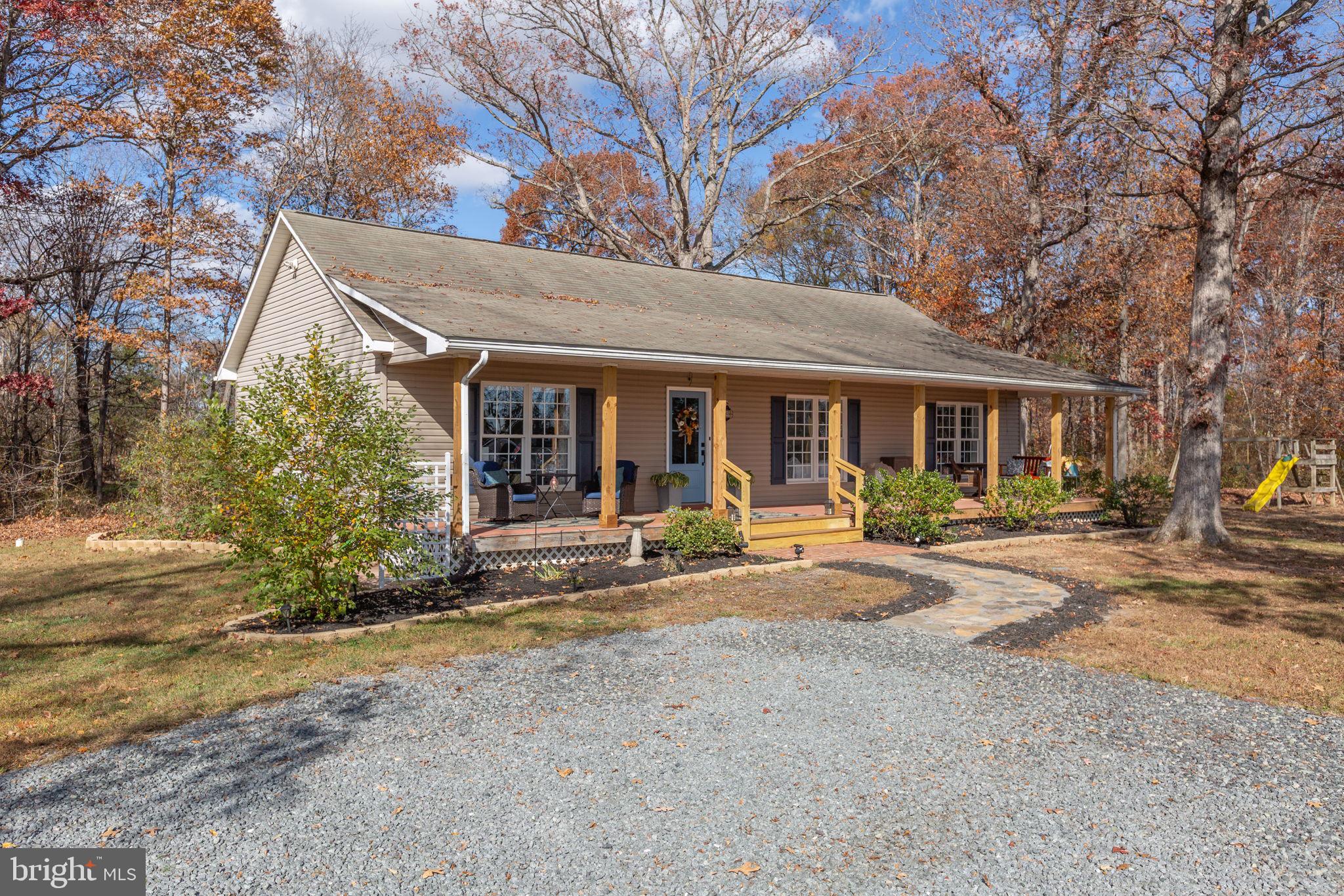 28896 Horseshoe Road Culpeper, VA 22701 - Photo 2 of 36 a view of a house with entertaining space and large trees