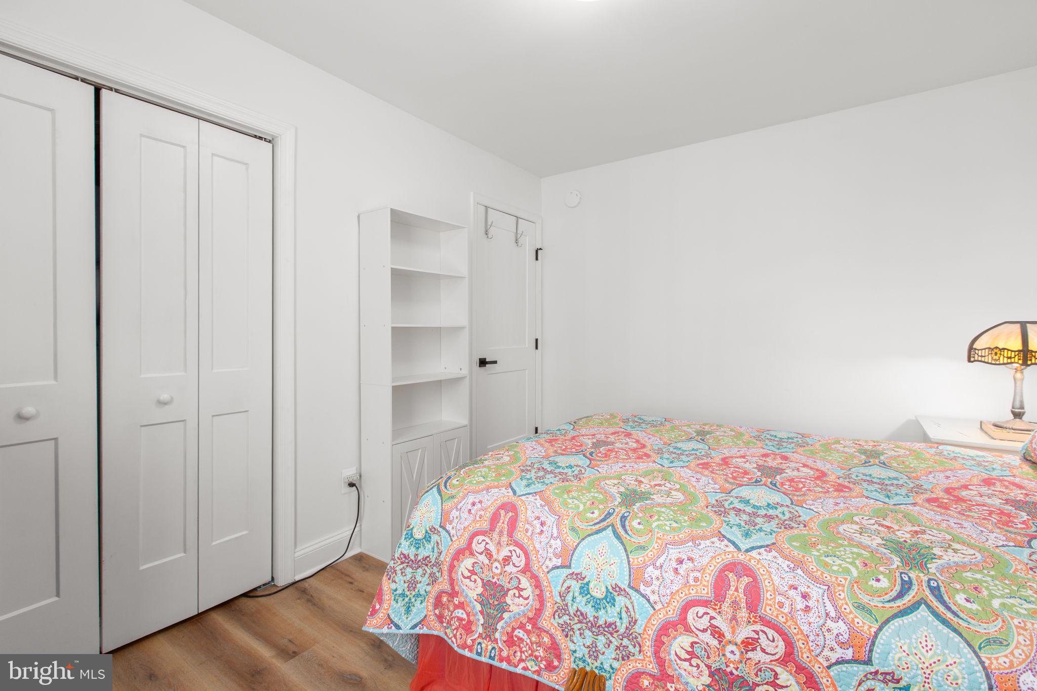 28896 Horseshoe Road Culpeper, VA 22701 - Photo 25 of 36 a bedroom with a bed and wooden floor