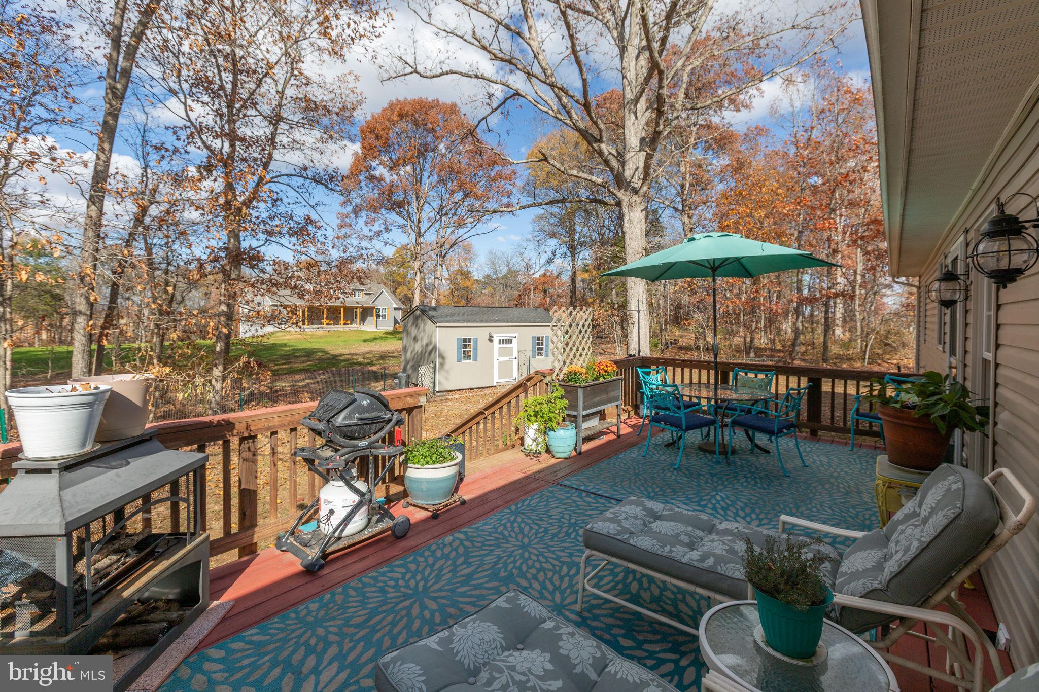 28896 Horseshoe Road Culpeper, VA 22701 - Photo 31 of 36 a view of a chairs and table in the patio