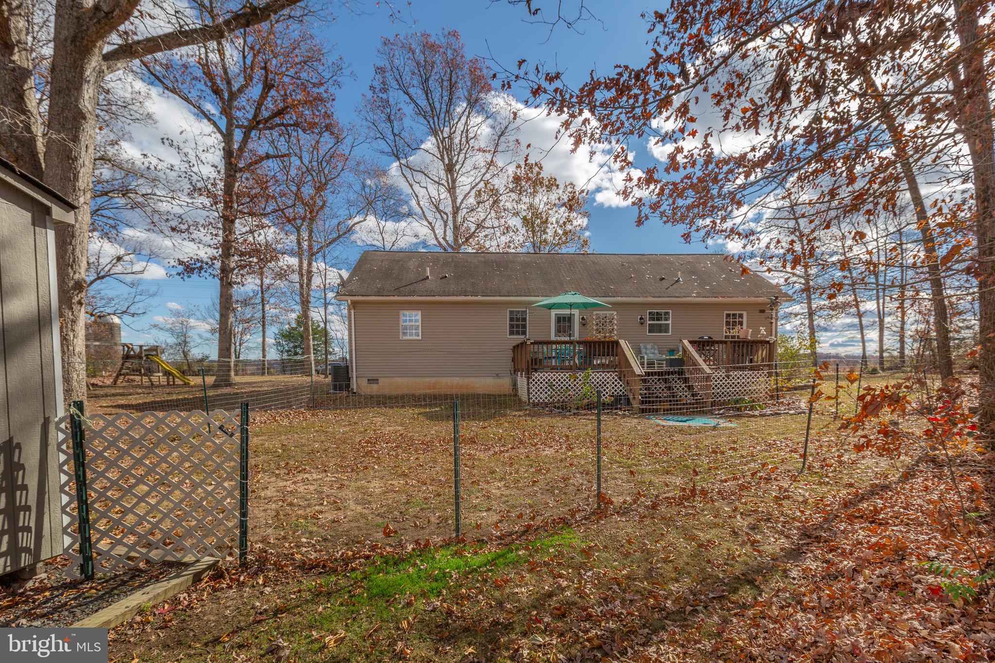 28896 Horseshoe Road Culpeper, VA 22701 - Photo 32 of 36 a view of a house with a yard and a garage