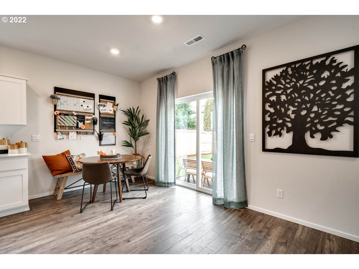 2667 26th Loop Springfield, OR 97477 - Photo 7 of 18 a view of a dining room with furniture and wooden floor