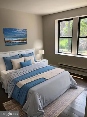 a bedroom with a bed and a window