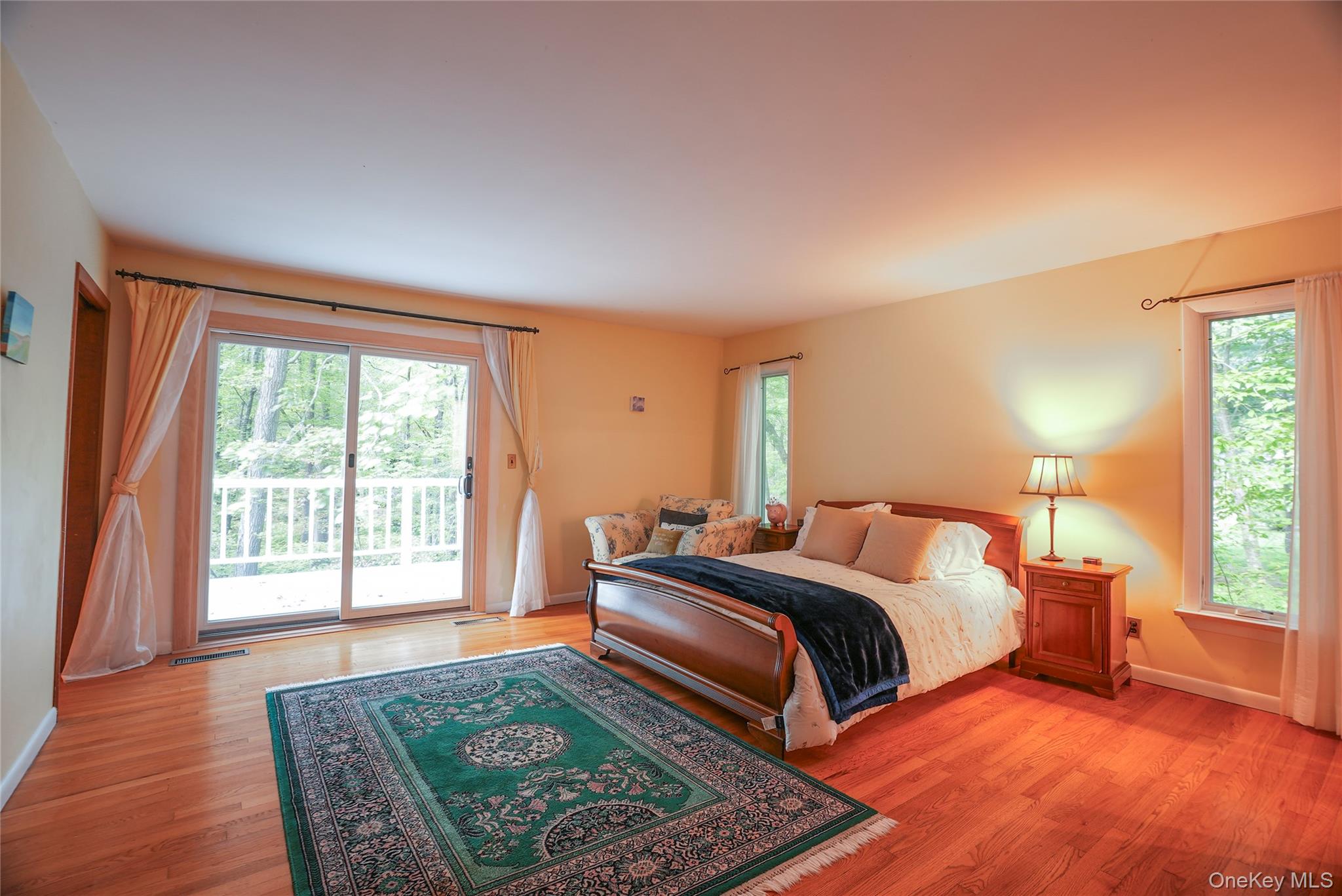 22 Peters Lane Pound Ridge, NY 10576 - Photo 17 of 43 Oversized primary bedroom w/ glass sliders to deck.