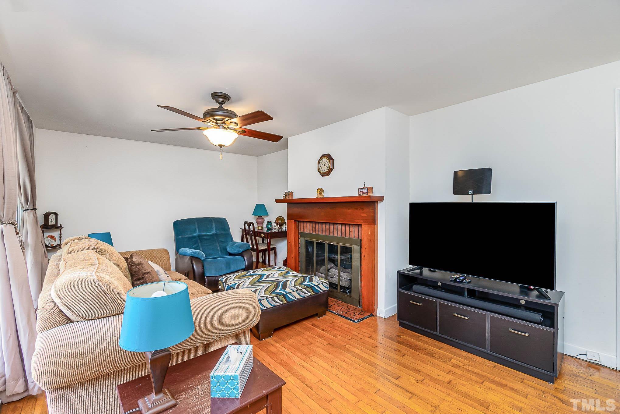 1921 Ebenezer Church Road Coats, NC 27521 - Photo 7 of 24 a living room with furniture and a flat screen tv