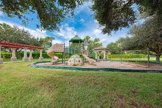 a view of a park with large trees