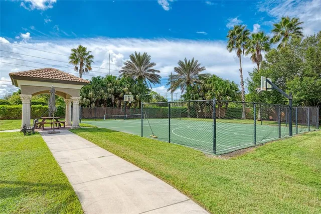 a view of a backyard with swimming pool