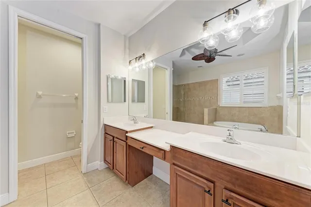 a bathroom with a sink double vanity and a mirror