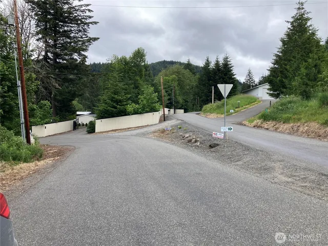 a view of a road with a yard