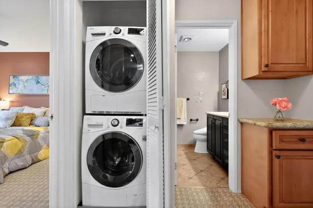 a view of a hallway with washer and dryer