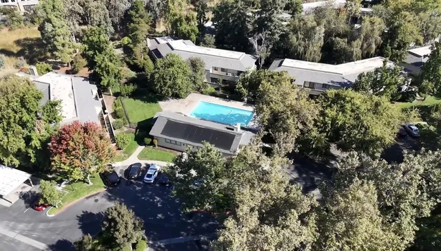 an aerial view of house with yard