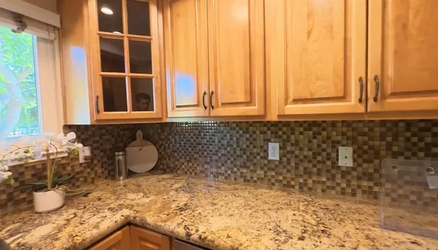 a bathroom with a sink and a window