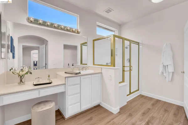 a bathroom with a double vanity sink and a mirror