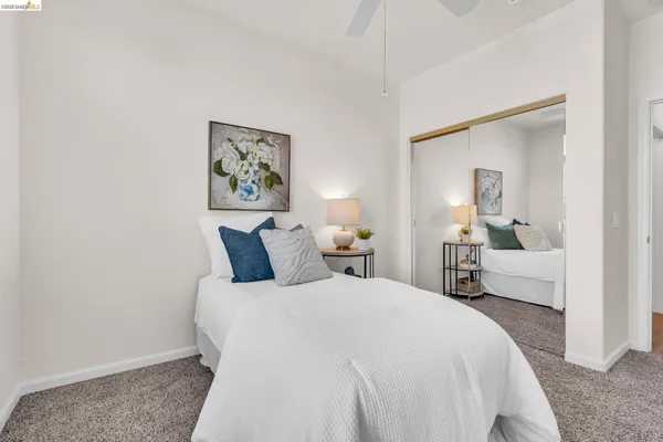 a bedroom with bed and window
