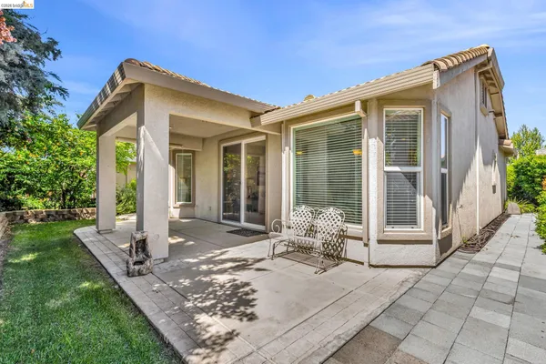 a front view of a house with a outdoor space