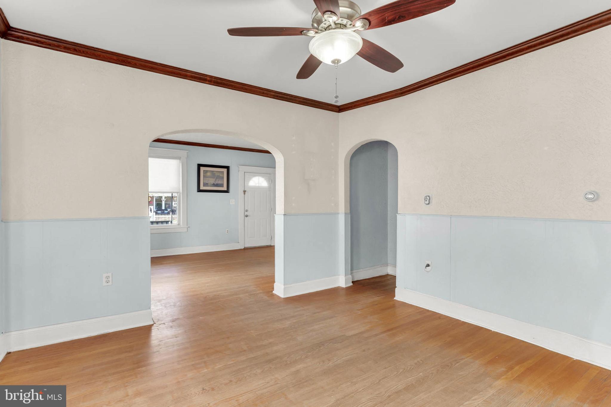 3724 5th Street Baltimore, MD 21225 - Photo 13 of 30 an empty room with wooden floor closet and windows
