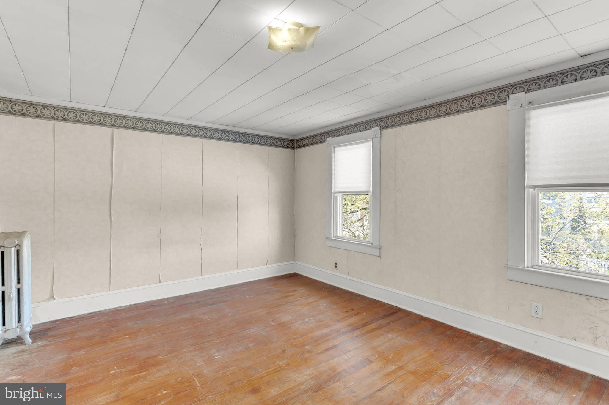 3724 5th Street Baltimore, MD 21225 - Photo 22 of 30 a view of an empty room with a window
