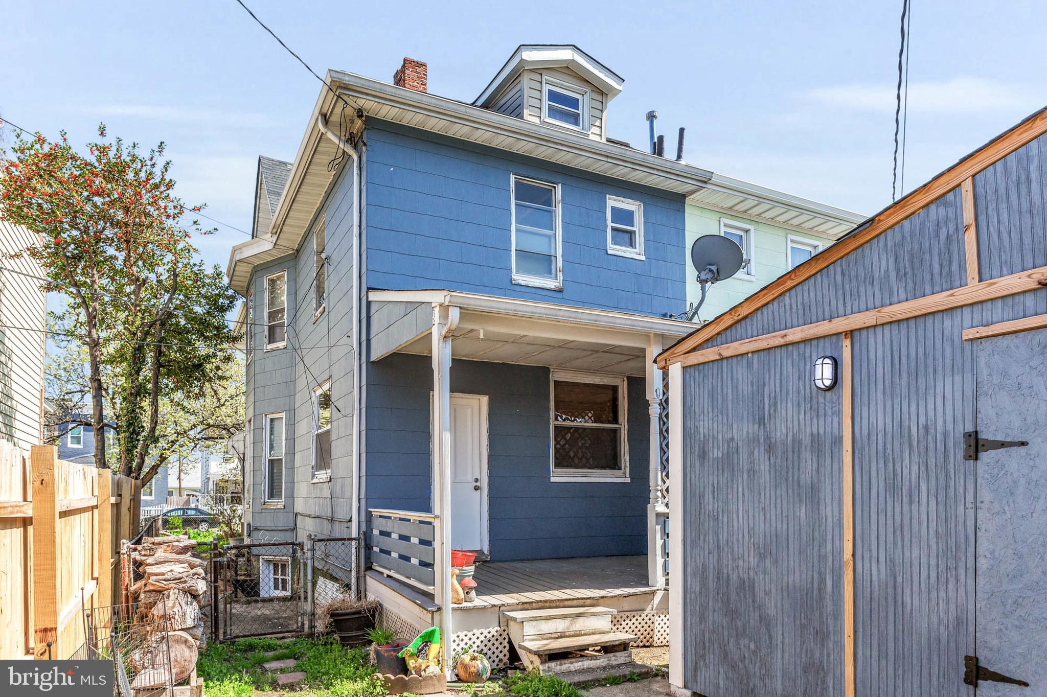 3724 5th Street Baltimore, MD 21225 - Photo 28 of 30 a front view of a house with garden