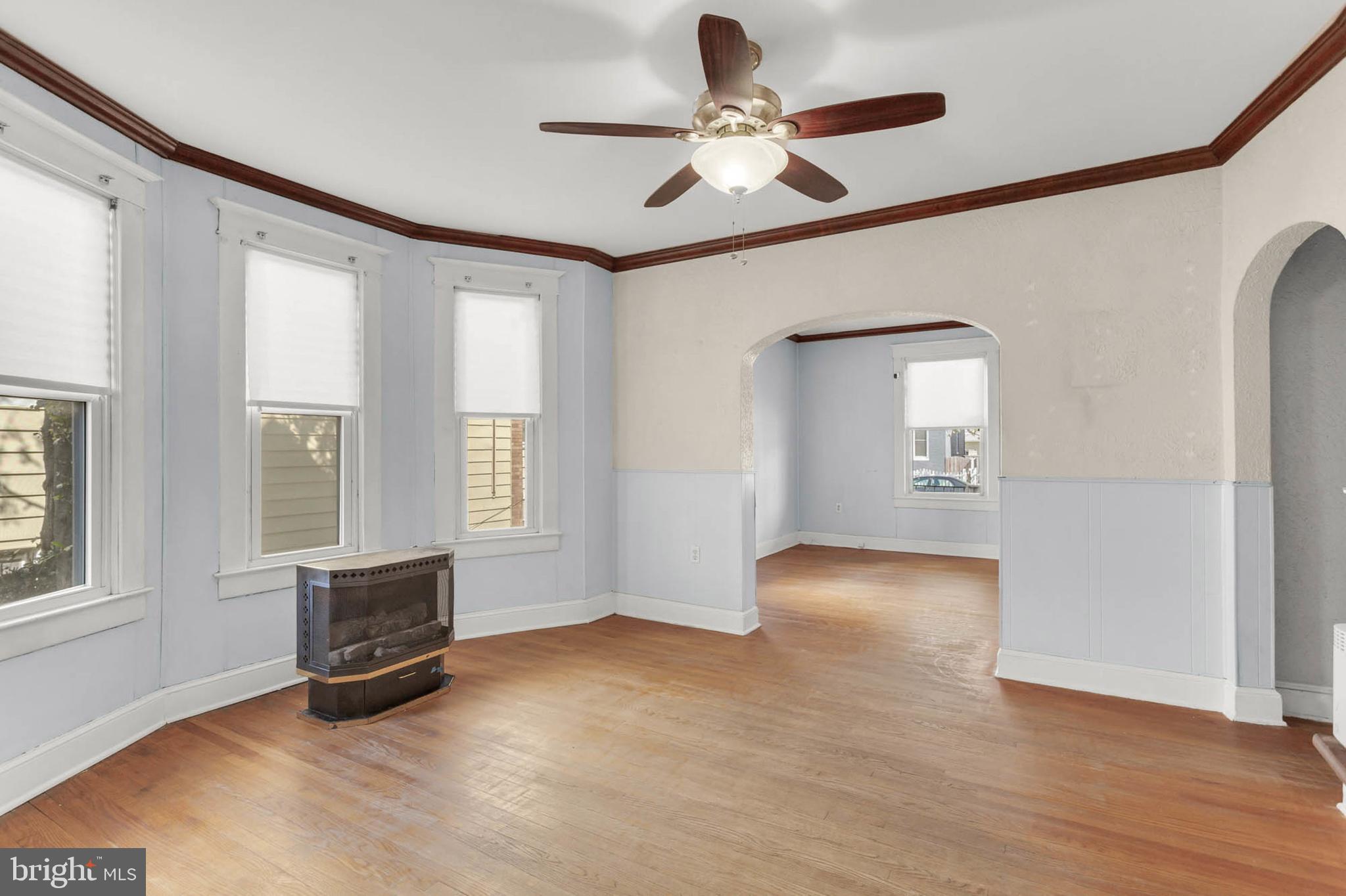 3724 5th Street Baltimore, MD 21225 - Photo 3 of 30 a view of an empty room with a window and a kitchen
