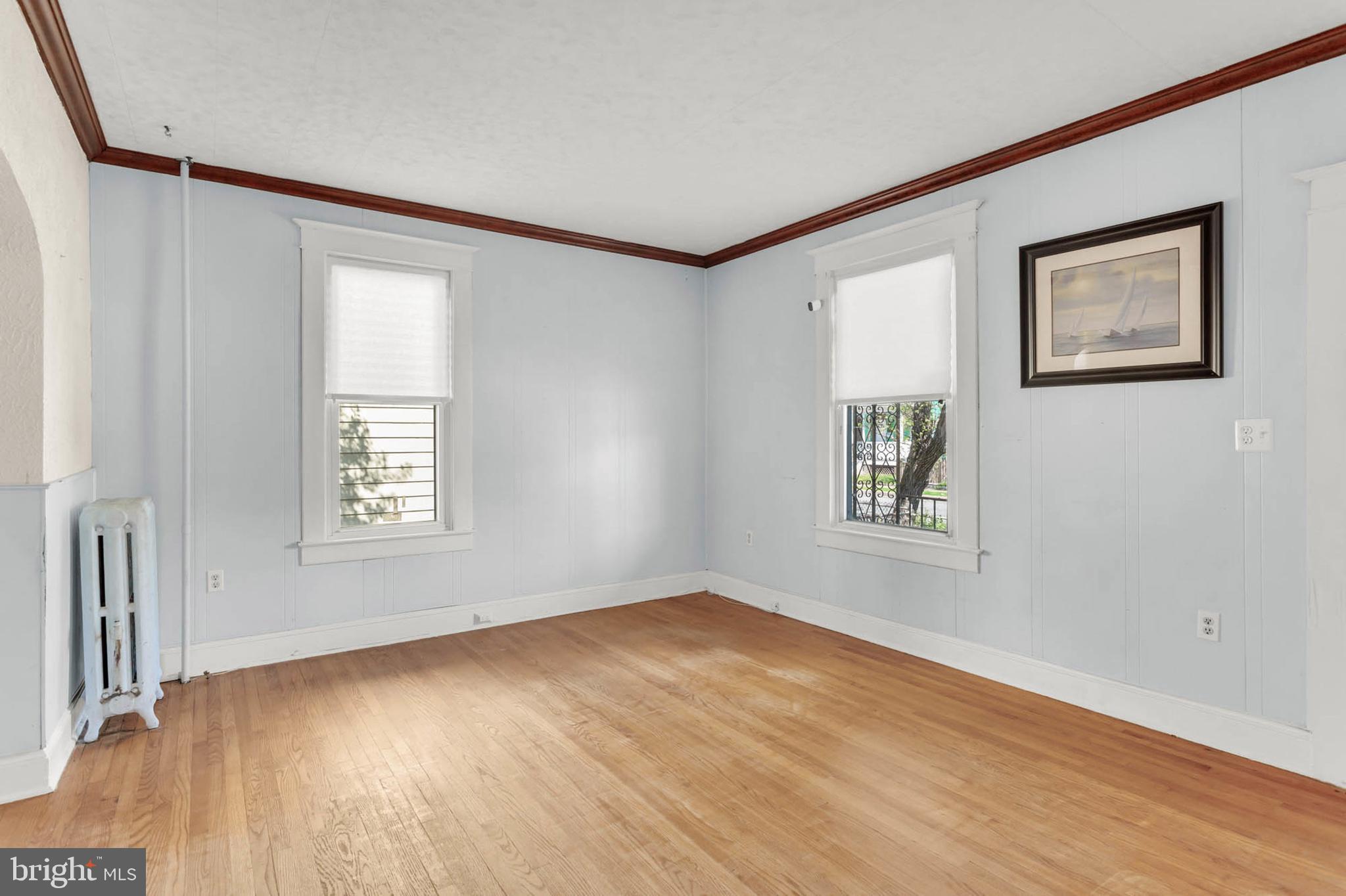 3724 5th Street Baltimore, MD 21225 - Photo 6 of 30 a view of an empty room with a window and wooden floor