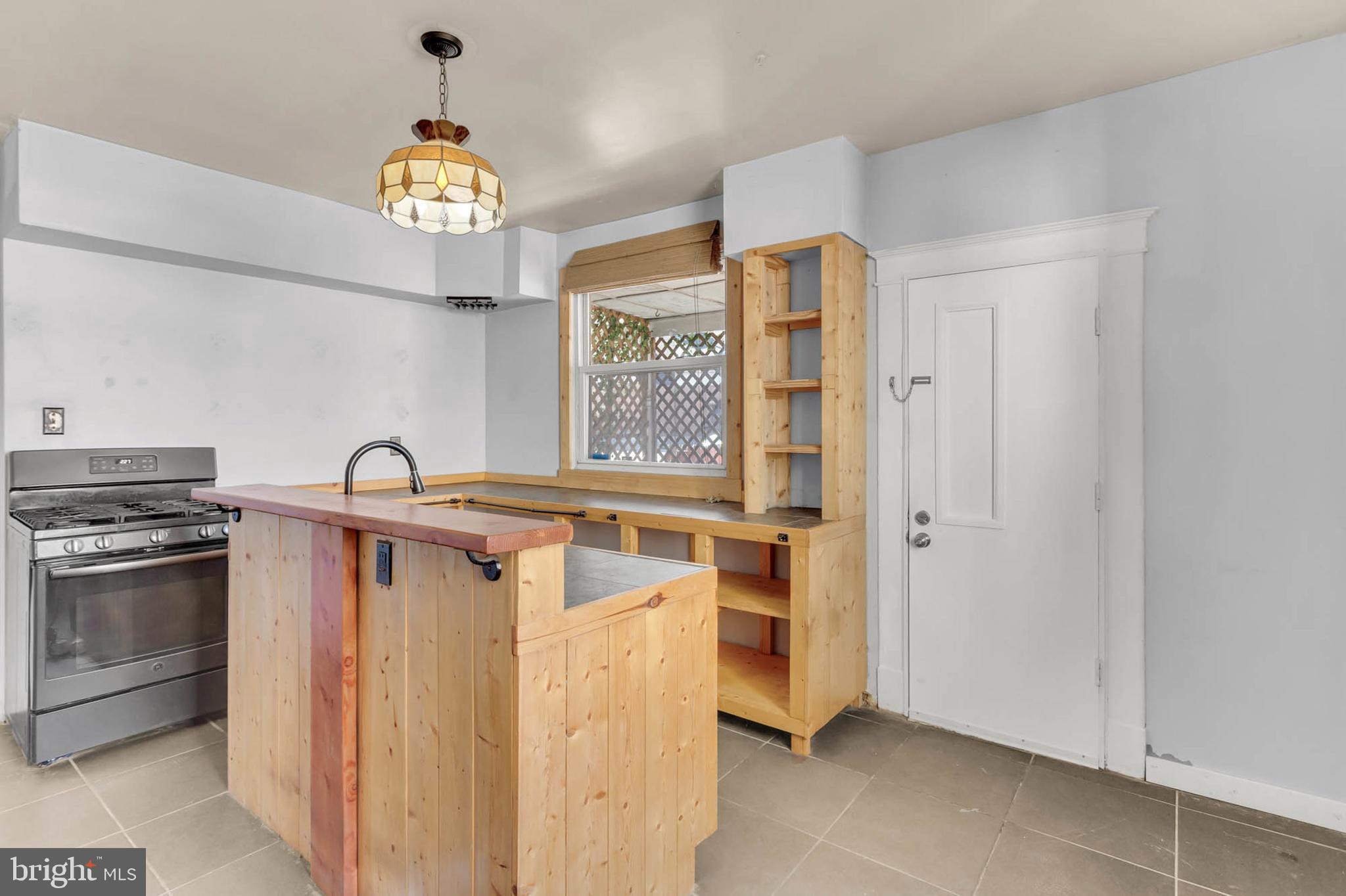 3724 5th Street Baltimore, MD 21225 - Photo 9 of 30 a view of a kitchen with a stove