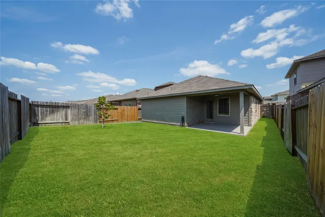 a view of a house with a back yard