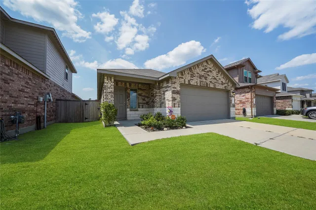a view of a house with a back yard