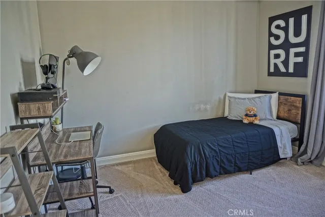 a bedroom with a bed and chair