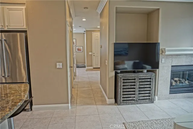 a kitchen with a refrigerator and a sink