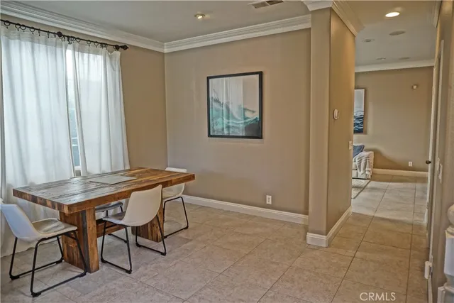 a view of a room that has a table and chair in it