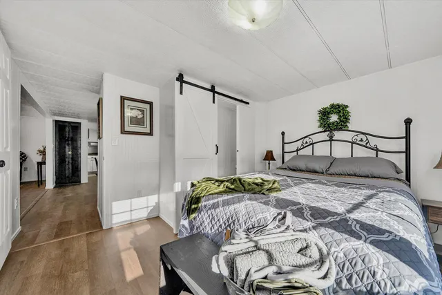 a bedroom with a bed and a table