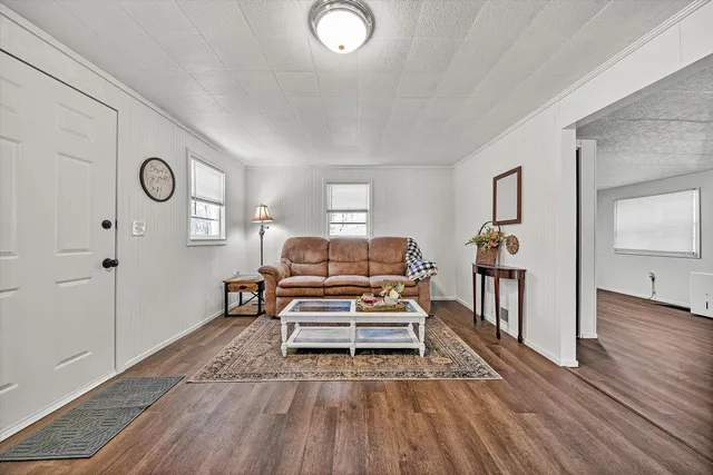 a view of a livingroom with furniture and wooden floor