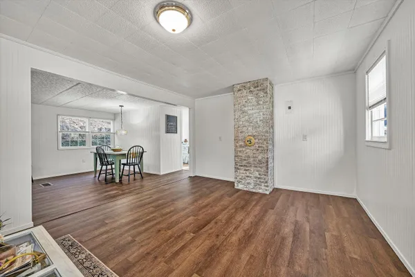 an empty room with furniture and a window