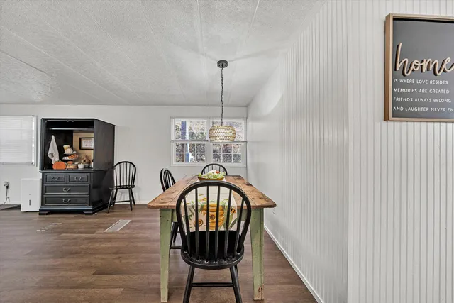 a view of a hallway with furniture and front door