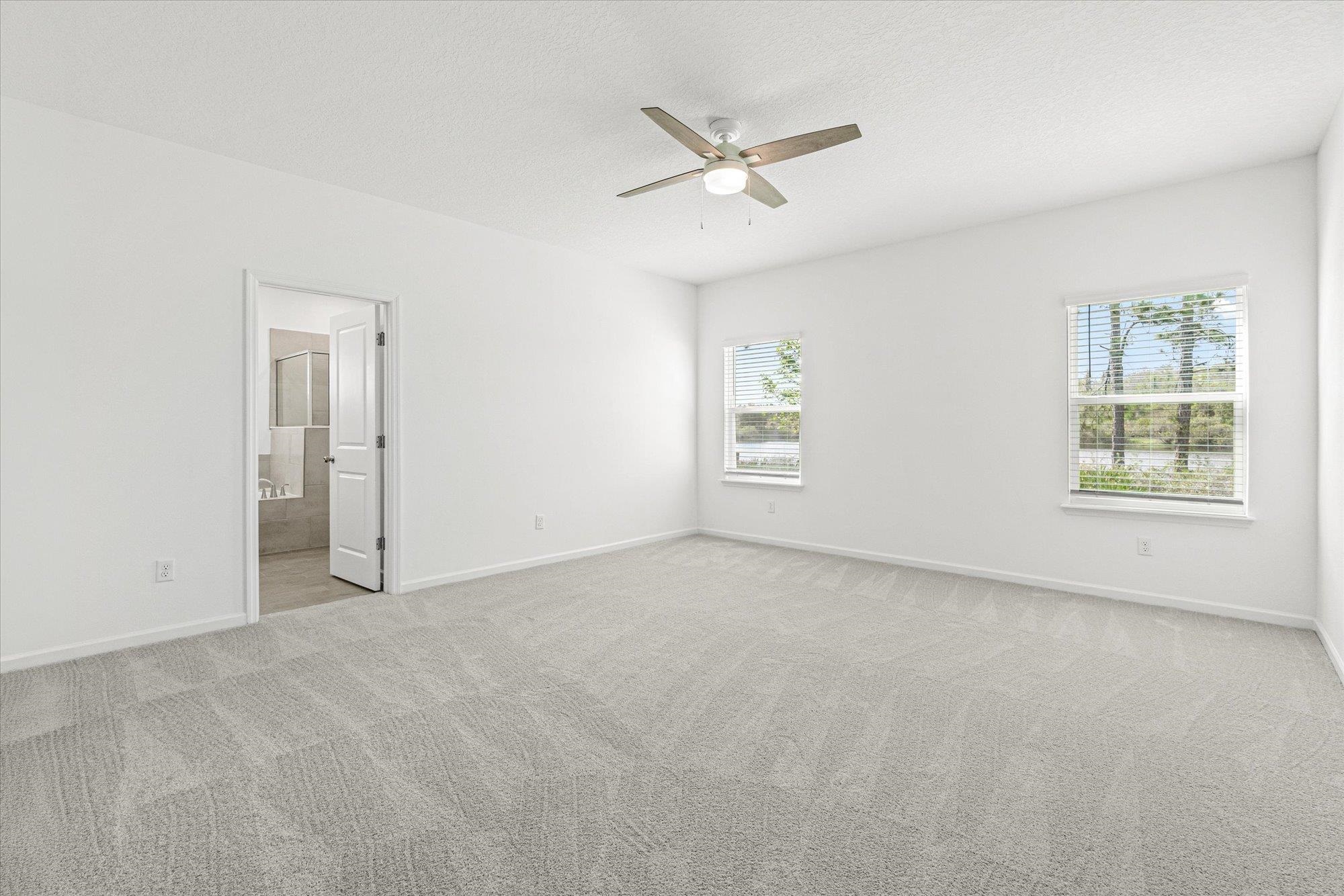 89 Kingsley Pk Way St. Augustine, FL 32084 - Photo 14 of 67 an empty room with windows and fan