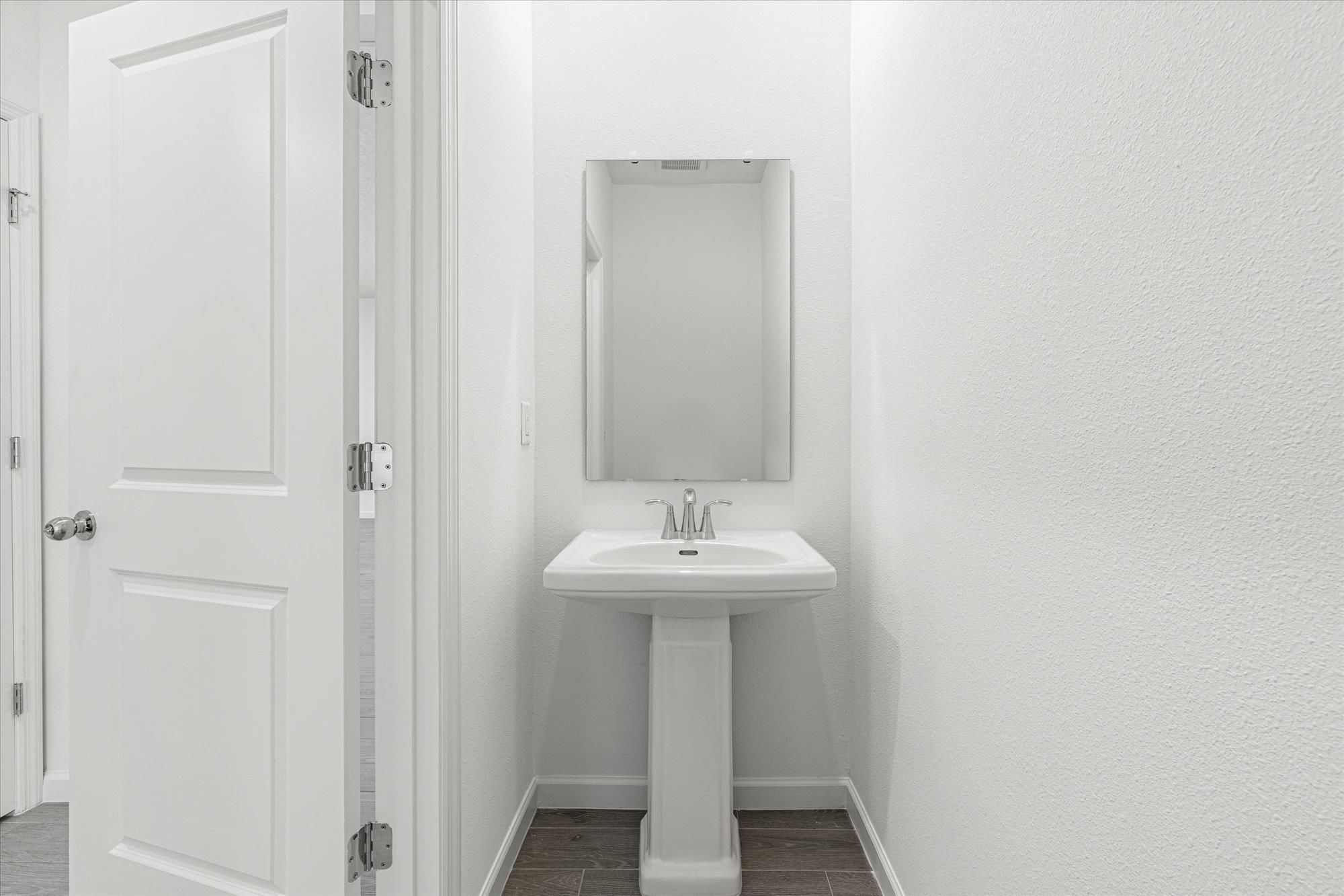 89 Kingsley Pk Way St. Augustine, FL 32084 - Photo 22 of 67 a bathroom with a sink and a mirror